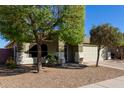 Front exterior view of a single-story home with a two-car garage at 221 N 151St Ave, Goodyear, AZ 85338