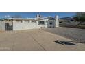 Inviting single-story home with a brick facade, xeriscaped yard, and a long driveway for ample parking at 2338 W Lupine Ave, Phoenix, AZ 85029