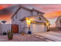 Charming two-story home with a well-manicured yard, two-car garage, and inviting front porch at 29576 N Gecko Trl, San Tan Valley, AZ 85143