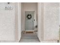 Close-up of the front door with stylish wreath and welcoming entryway at 3533 E Harwell Rd, Gilbert, AZ 85234