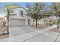 Inviting two-story home featuring a spacious driveway and lovely landscaping at 3533 E Harwell Rd, Gilbert, AZ 85234