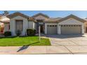 Charming single-story home featuring a well-maintained lawn and a spacious two-car garage at 3751 S Vista Pl, Chandler, AZ 85248