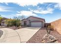 Beautiful single-story home featuring desert landscaping, cactus, and a two-car garage at 41401 N Maidstone Ct, Anthem, AZ 85086