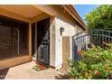Inviting front entrance with a secure screen door and decorative butterfly welcome mat at 4226 E Jojoba Rd, Phoenix, AZ 85044