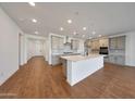 Modern eat-in kitchen featuring an island with sink, quartz countertop, tile backsplash and recessed lighting at 4552 W Willow Run --, San Tan Valley, AZ 85144