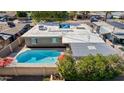 Overhead view of a private backyard featuring a refreshing pool, patio, and meticulously maintained landscaping at 5401 N 81St Pl, Scottsdale, AZ 85250