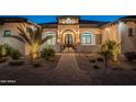 Inviting front entrance of a luxury home with brick pathway and manicured landscaping at 6378 S 154Th St, Gilbert, AZ 85298