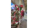 Charming home exterior enhanced by colorful flowers, creating a vibrant and welcoming curb appeal at 11411 N 91St Ave # 48, Peoria, AZ 85345