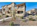 Two-story townhome boasts a private walkway, desert landscaping, and a covered patio at 1255 N Arizona Ave # 1093, Chandler, AZ 85225