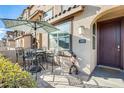 Charming front patio with an outdoor dining set and a welcoming entrance at 1255 N Arizona Ave # 1093, Chandler, AZ 85225