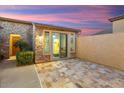 Private outdoor patio area with stone pavers and a sliding glass door leading indoors at 12663 W Pinnacle Vista Dr, Peoria, AZ 85383