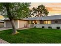 Charming single-story home featuring a spacious two-car garage and well-maintained landscaping with mature trees at 12703 W Shadow Hills Dr, Sun City West, AZ 85375