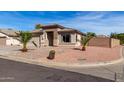 Single-story home featuring desert landscaping, a two-car garage, and a cozy, welcoming entrance at 16035 N 159Th Dr, Surprise, AZ 85374