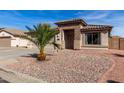 Charming single-story home featuring a desert landscape, tile roof, and cozy, welcoming entrance at 16035 N 159Th Dr, Surprise, AZ 85374