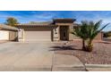 Inviting single-story home featuring a desert landscape and a two-car garage at 16035 N 159Th Dr, Surprise, AZ 85374