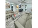 Inviting living room with neutral sofas and a view of the dining area and adjacent kitchen at 1953 W Granada Rd, Phoenix, AZ 85009