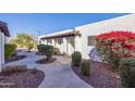 Landscaped walkway between buildings in a well-maintained community at 2401 N 70Th St # G, Scottsdale, AZ 85257