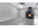 Spacious living room with a skylight and statement brick fireplace at 2593 E Commonwealth Cir, Chandler, AZ 85225