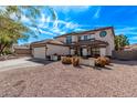 Charming two-story home with a tile roof, desert landscaping, and a well-manicured lawn at 28422 N 32Nd Ln, Phoenix, AZ 85083