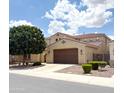 Two-story home with private driveway, 2-car garage, well maintained landscaping, and a tile roof at 3687 E Blue Spruce Ln, Gilbert, AZ 85298