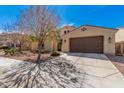 A charming single-Gathering home with a low-maintenance desert landscape and a two-car garage at 3687 E Blue Spruce Ln, Gilbert, AZ 85298