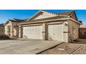 Attached three-car garage with white doors and a concrete driveway at 3756 E Camden Ave, San Tan Valley, AZ 85140
