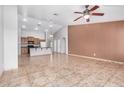 Bright living room featuring vaulted ceilings, an open floor plan, and views of the kitchen at 3756 E Camden Ave, San Tan Valley, AZ 85140