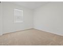 Bedroom with plush carpet, a large window, and fresh white walls at 3806 N Camden Dr, Florence, AZ 85132