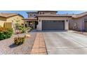 A well-maintained home featuring a spacious driveway and tidy landscaping enhances the property's appeal at 3935 E Blue Spruce Ln, Gilbert, AZ 85298