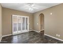 Cozy bedroom featuring tile floors, ceiling fan, and access to a patio at 3935 E Rough Rider Rd # 1368, Phoenix, AZ 85050