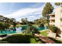 Beautiful pond view in a lush green setting with trees at 5124 N 31St Pl # 536, Phoenix, AZ 85016