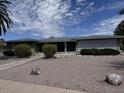 Charming home featuring a well-manicured front yard with desert landscaping and a walkway to the entrance at 6132 E Decatur St, Mesa, AZ 85205