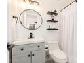 This bathroom features modern lighting, sleek fixtures, and decorative shelving at 623 W Guadalupe Rd # 228, Mesa, AZ 85210