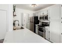 Bright kitchen with quartz countertops, stainless steel appliances, and white subway tile backsplash at 623 W Guadalupe Rd # 228, Mesa, AZ 85210