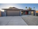 Charming home with a well-maintained exterior, a spacious driveway, and a welcoming entrance at 15034 N 54Th St, Scottsdale, AZ 85254