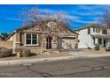 Charming single-Gathering home featuring a two-car garage and well-maintained landscaping at 17192 W Post Dr, Surprise, AZ 85388