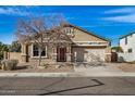 Charming single-Gathering home featuring a two-car garage and well-maintained landscaping at 17192 W Post Dr, Surprise, AZ 85388