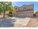 Two-story house with a spacious three-car garage, neutral color scheme, and landscaped front yard at 1831 W San Angelo St, Gilbert, AZ 85233