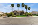 Single story home with mature landscaping and a stone exterior at 23415 S 202Nd St, Queen Creek, AZ 85142