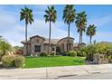 Beautiful single-Gathering home with a stone facade and a lush green lawn at 23415 S 202Nd St, Queen Creek, AZ 85142