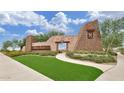 Stone community entrance with desert landscaping and blue sky at 2463 E Stacey Rd, Gilbert, AZ 85298