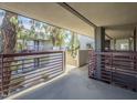 View from balcony with steel rails overlooking other units and greenery in a well-kept area at 3420 W Danbury Dr # C216, Phoenix, AZ 85053