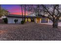 Charming single-story home featuring a well-manicured front yard and a two-car garage at 3531 E Becker Ln, Phoenix, AZ 85028