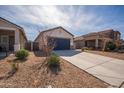 Attractive single-story home featuring low-water landscaping and a two-car garage at 36529 W San Capistrano Ave, Maricopa, AZ 85138