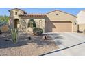 Charming single-story home with desert landscaping, neutral colors, and a front-facing two-car garage at 4960 S Huachuca Pl, Chandler, AZ 85249