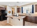 Stylish kitchen with granite countertops, stainless steel appliances, and a breakfast bar at 4960 S Huachuca Pl, Chandler, AZ 85249