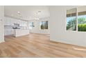 Bright and airy open floor plan with wood floors and recessed lighting at 625 N Vine St, Chandler, AZ 85225