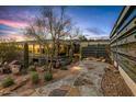 Contemporary home featuring desert landscaping and a stone walkway at 7686 E Stagecoach Pass Rd, Carefree, AZ 85377