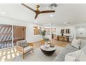 Open-concept living room with modern décor, light wood floors, and an accent ceiling fan at 8088 E Via Del Valle --, Scottsdale, AZ 85258