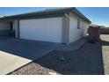 Attached two-car garage providing convenient parking and storage at 8235 E Medina Ave, Mesa, AZ 85209